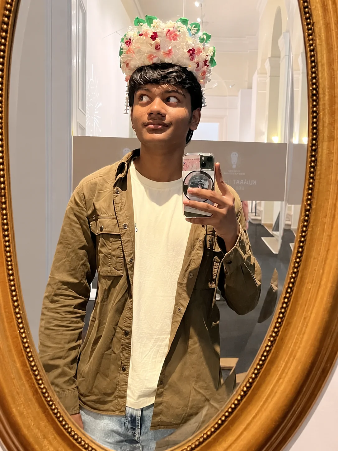 A mirror selfie wearing a crown