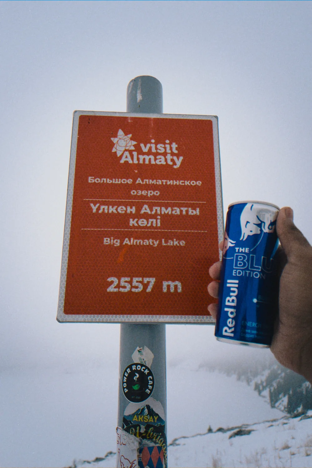 A Big Almaty Lake sign in the snow