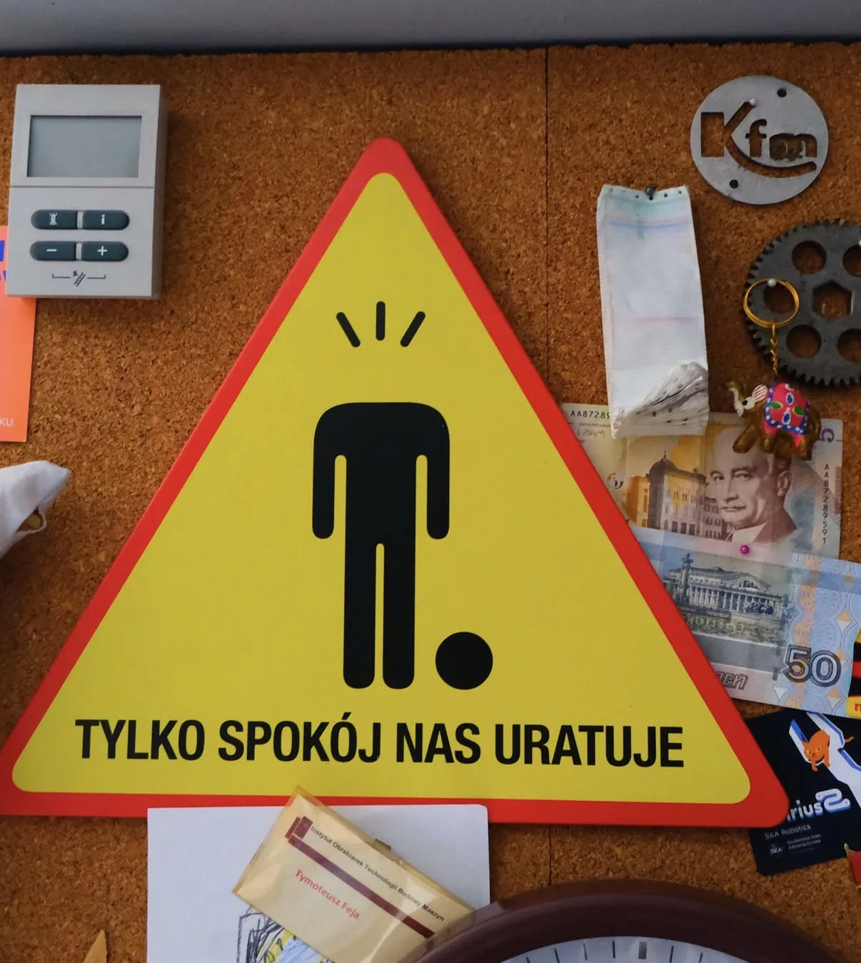 A Polish sign pinned to a noticeboard