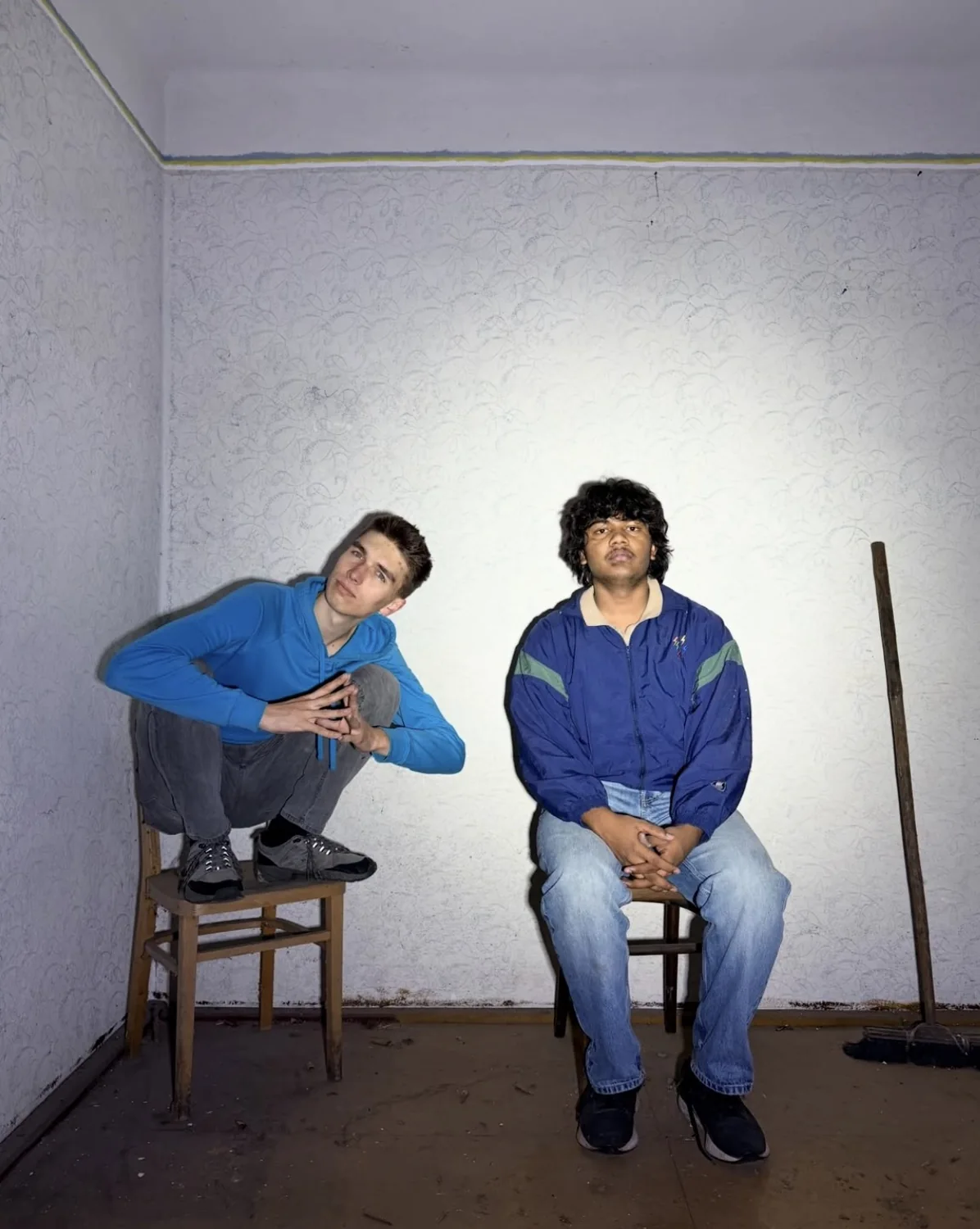 Sitting with a friend in a sparsely furnished room